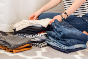 Image of a woman sorting her wardrobe