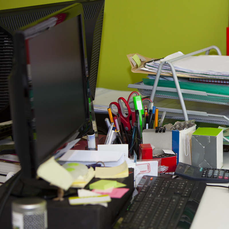Photo of a messy desk needing organising and decluttering. workshops in Sydney